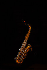Fototapeta na wymiar Tenor saxophone on a black background