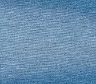 Denim texture in close up view with copy space for vintage background or wallpaper. Blue jeans pattern no seam with macro style to preset about classic fashion cloths concept.