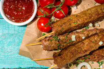 Lula kebab, shish kebab on wood skewer with minced beef, grill and bbq concept