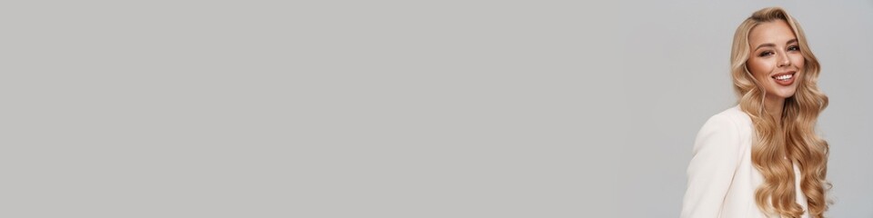 Beautiful happy girl in jacket smiling and looking at camera