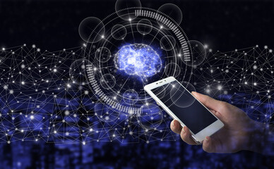 Global database and artificial intelligence. Hand hold white smartphone with digital hologram Brain sign on city dark blurred background. The modern concept of the cyberbrain.