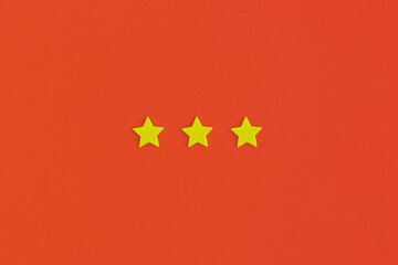 Three 3 stars, best excellent services rating on red background.
