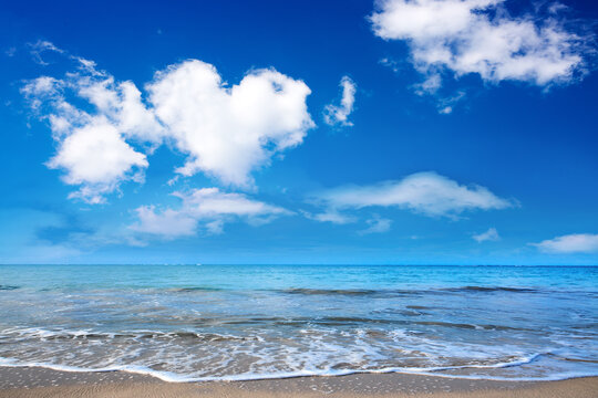 Beautiful caribbean sea and blue clouds sky. Travel background.