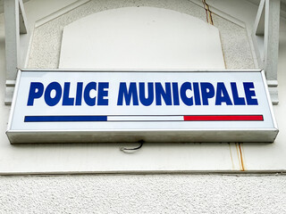 "Municipal Police" french sign at the entrance of a police station