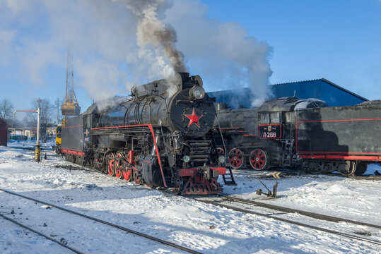 SORTAVALA, RUSSIA - MARCH 10, 2021: Old Soviet steam locomotives on the Sortavala station on a frosty March day
