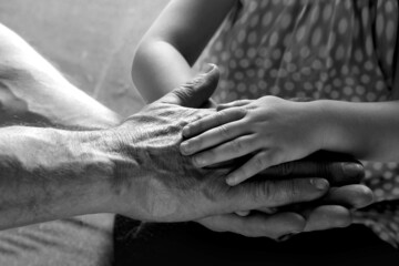 adult male hands holding kid hands, Family Help Care Concept, small hands in fathers hand, touching moment, touch of child and old man, grandfather, parents and child, adopted children, adoption