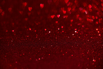 Red hearts, sparkling glitter bokeh background, valentines day abstract defocused texture