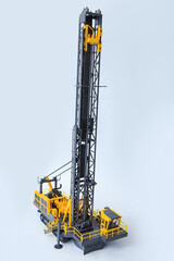 Large drill rig for drilling boreholes for explosives on a white background. Technologies of...