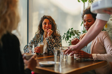 Lifelong friends catching up over coffee