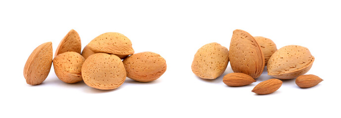 Heap of fresh almonds in shells isolated on white background