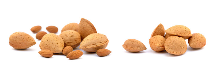 Heap of fresh almonds in shells isolated on white background