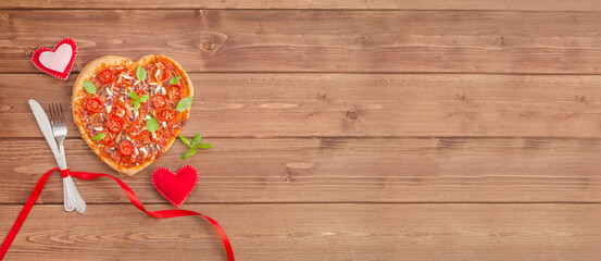 Valentine's Day banner with pizza heart on a dark wooden background with copy space
