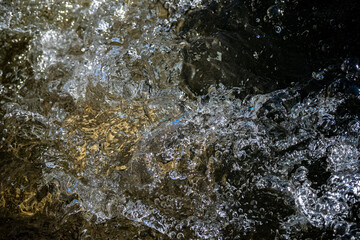 Close up detail of frozen ice in stream during the winter