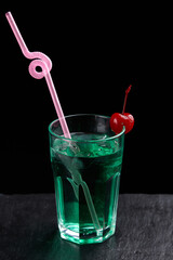 Alcoholic drinks at the bar. Bartender's hands in the process of making drinks.