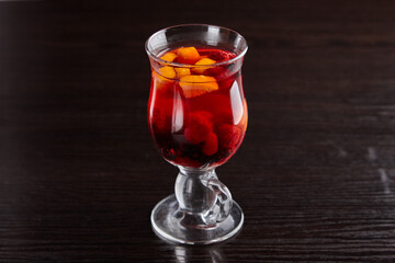 Alcoholic drinks at the bar. Bartender's hands in the process of making drinks.