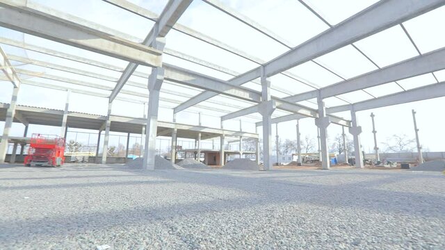 Construction site with reinforced concrete structure. Construction of a large industrial building. Industrial interior at a construction site