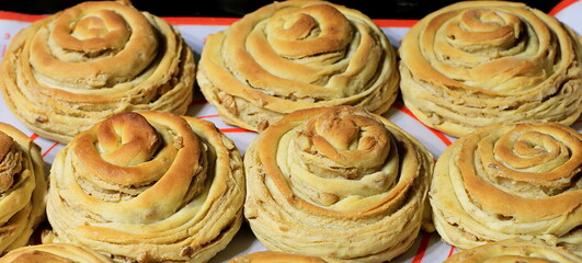 Tahinli çörek - sweet buns with tahini (sesame paste). National Turkish pastry. 
Authentic Turkish buns with sesame paste (tahini) and walnuts are delicious, sweet, flaky and soft. 
