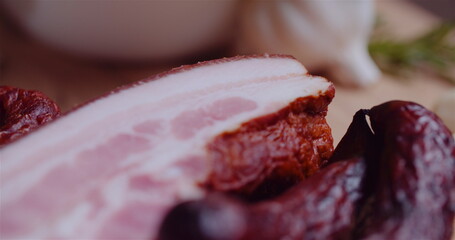 Close up of Bacon, Ham and Sasuage Rotating on Plate.