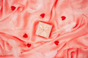 Valentine's day pink background. Folds of silk fabric.