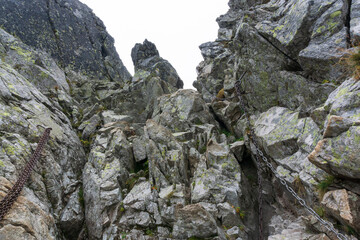 Rocks and chains on the Bystra lavka pass. High Tatras. Slovakia.