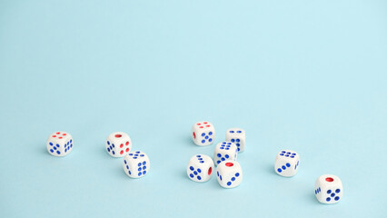 Dice cubes on a blue background. Creative idea, randomness concept.