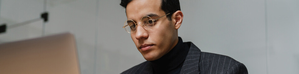 Mid aged brunette man entrepreneur in suit