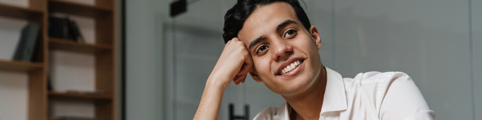 Brunette mid aged businessman wearing white shirt