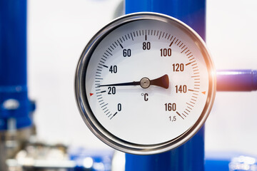 Industrial  concept. equipment of the boiler-house, - valves, tubes, pressure gauges, thermometer. Close up of manometer, pipe, flow meter, water pumps and valves of heating system in a boiler room.