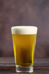 beer in a glass on a dark background
