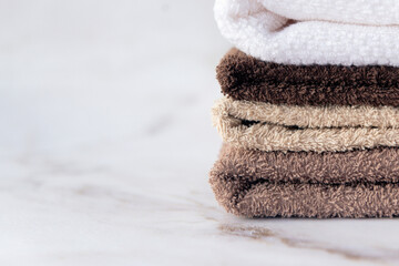 pack of terry cotton towels in bathroom natural colors copy space