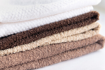 Fototapeta na wymiar pack of terry cotton towels in bathroom natural colors