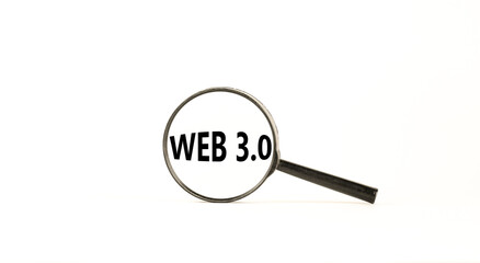 WEB 3.0 symbol. Concept words WEB 3.0. Magnifying glass. Beautiful white table, white background. Copy space. Business, technology and WEB 3.0 concept.