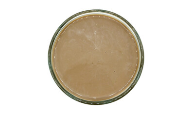 Chocolate milk in glass isolated top view