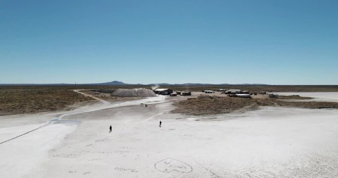 People walking on the salt flats. Salinas del Diamante, San Rafael. Mendoza. Argentina.