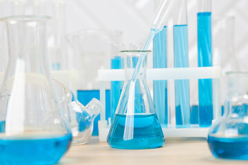 Laboratory glassware with test tubes. flasks, dropper, petri dishes, measuring cups and cylinders for scientific laboratories,