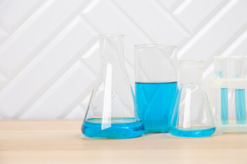 Laboratory glassware with test tubes. flasks, dropper, petri dishes, measuring cups and cylinders for scientific laboratories, laboratory equipment and analysis