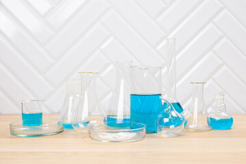 Laboratory glassware with test tubes. flasks, dropper, petri dishes, measuring cups and cylinders for scientific laboratories, laboratory equipment and analysis
