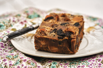 muffin with plum and figs on a white plate