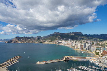 sailboats in the marina of Calpe and clouds on the Mediterranean coast in Spain