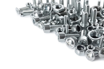 Different metal bolts and nuts on white background