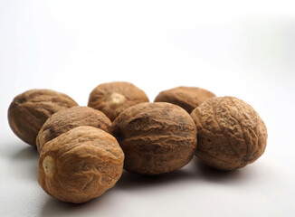 Several nutmegs on a white background