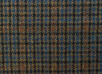 Obraz premium Heritage British Wool Tweed. Coat close-up. Expensive men's suit fabric. Background Texture. High resolution