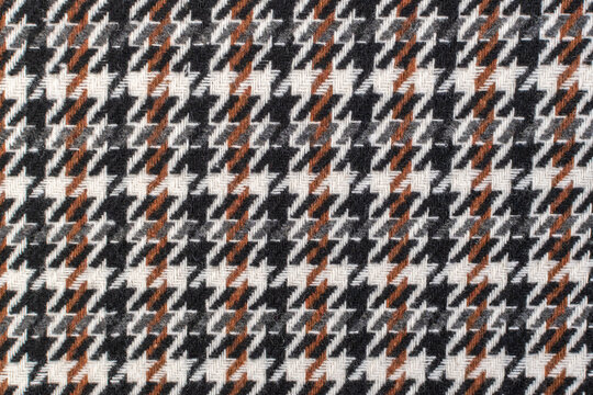 Classic tweed, Wool Background Texture. Coat close-up. Expensive men's suit fabric. Glenurquhart check is made of woolen fabric with a woven twill design of small and large checks. Houndstooth seamles