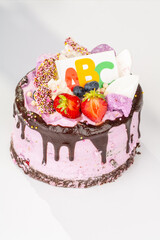 Banner of Beginning of the school year concept, festive cake with ABC. Back to school. Hello school. Time to learn. Education. First September. Close up