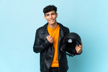 Argentinian man with a motorcycle helmet celebrating a victory