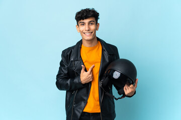 Argentinian man with a motorcycle helmet with surprise facial expression