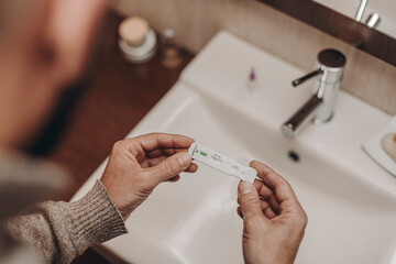 man seeing negative result in covid antigen test