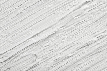 Strokes of white oil paint as background, closeup