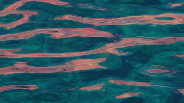 Sea surface with gentle waves and smooth ripples