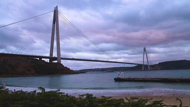 Yavuz Sultan Selim Bridge in evening illumination. Suspension bridges in İstanbul, Turkey with cloudy sky Background.